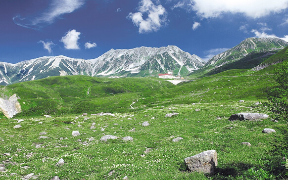 Green mountain slopes of the Tateyama Range and surrounding highlands in Toyama
